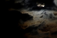 雲のかかった月の写真素材